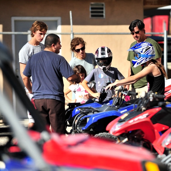 Guests talking before riding ATVs