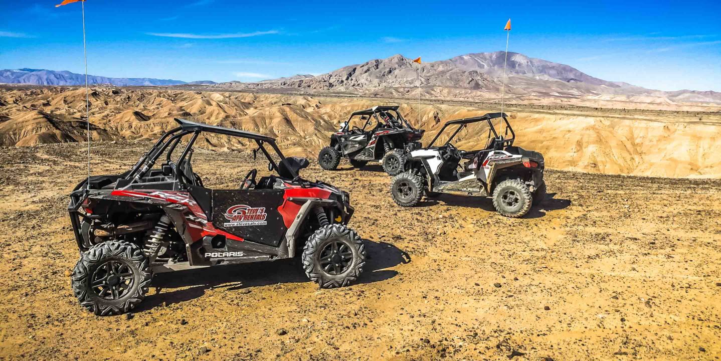 Three UTVs off roading