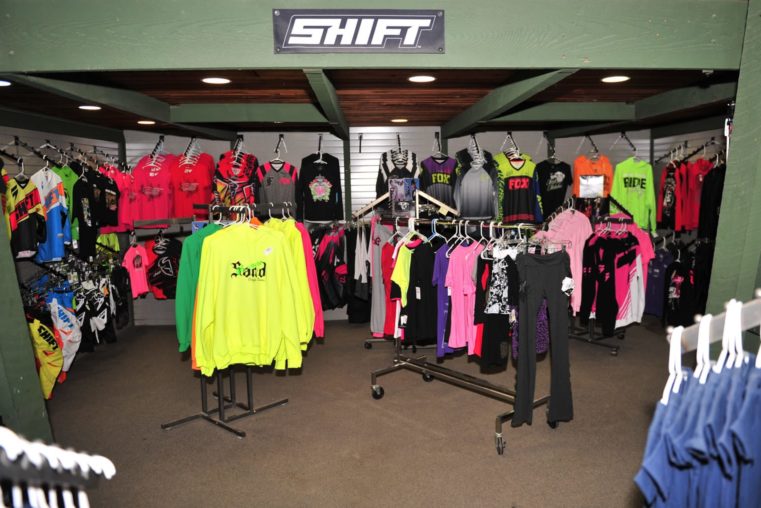 Clothing and gear at the Oregon Dunes Motorsports service and parts shop