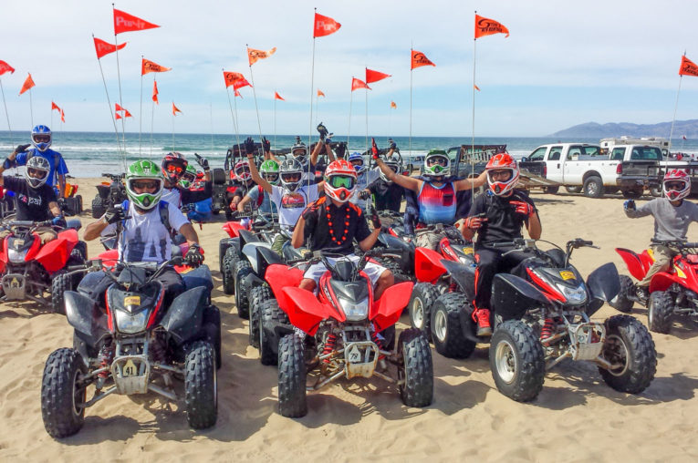 Large group on ATVs at Pismo Beach