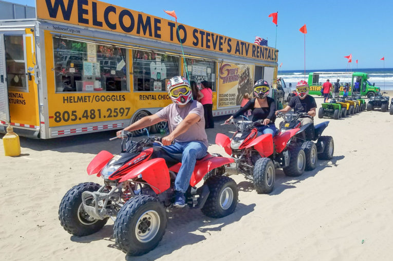 Guests riding on ATVs at Pismo Beach