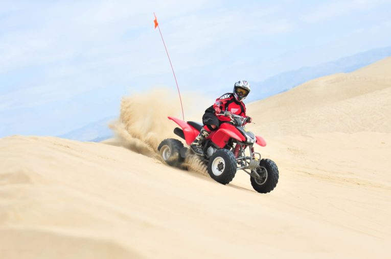 Guest riding an ATV in Pismo Beach